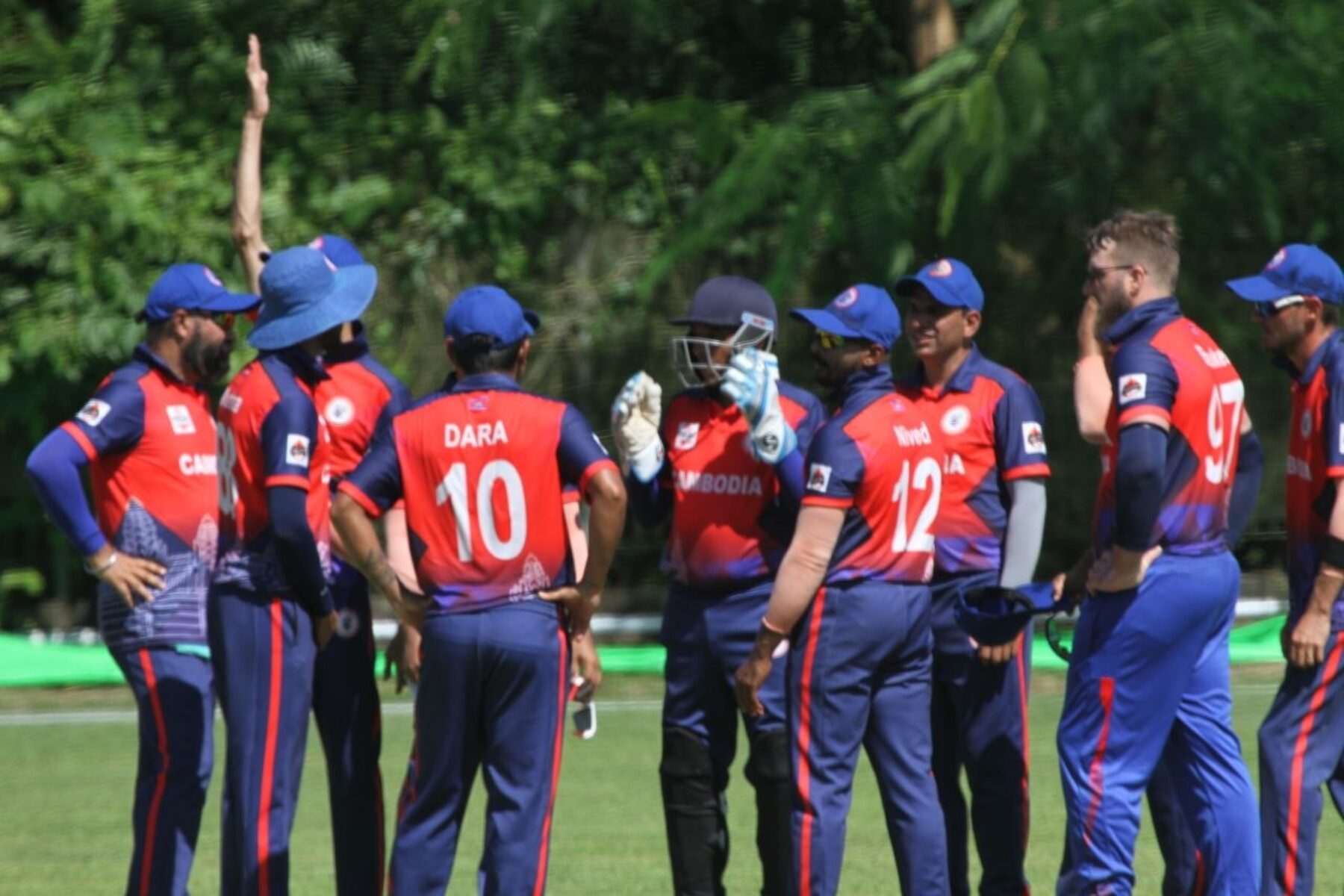 Cambodia cricket team huddle